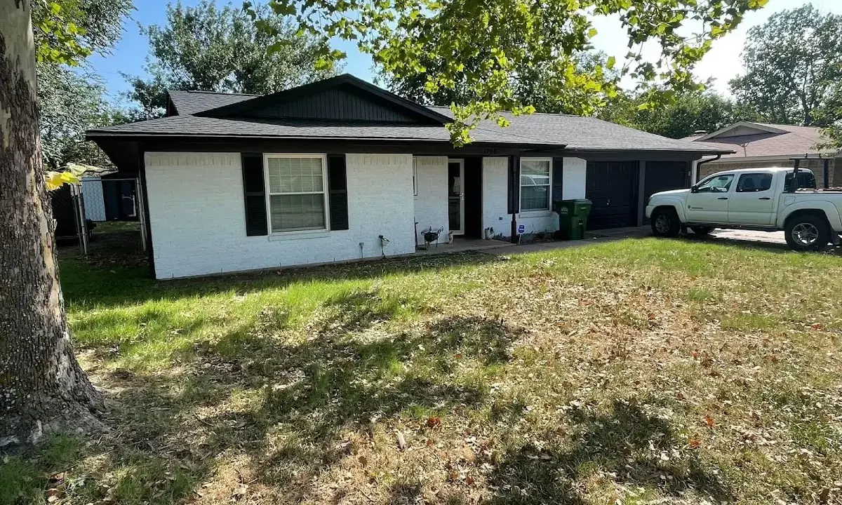 Professional roofing crew working on a residential roof in New Baltimore